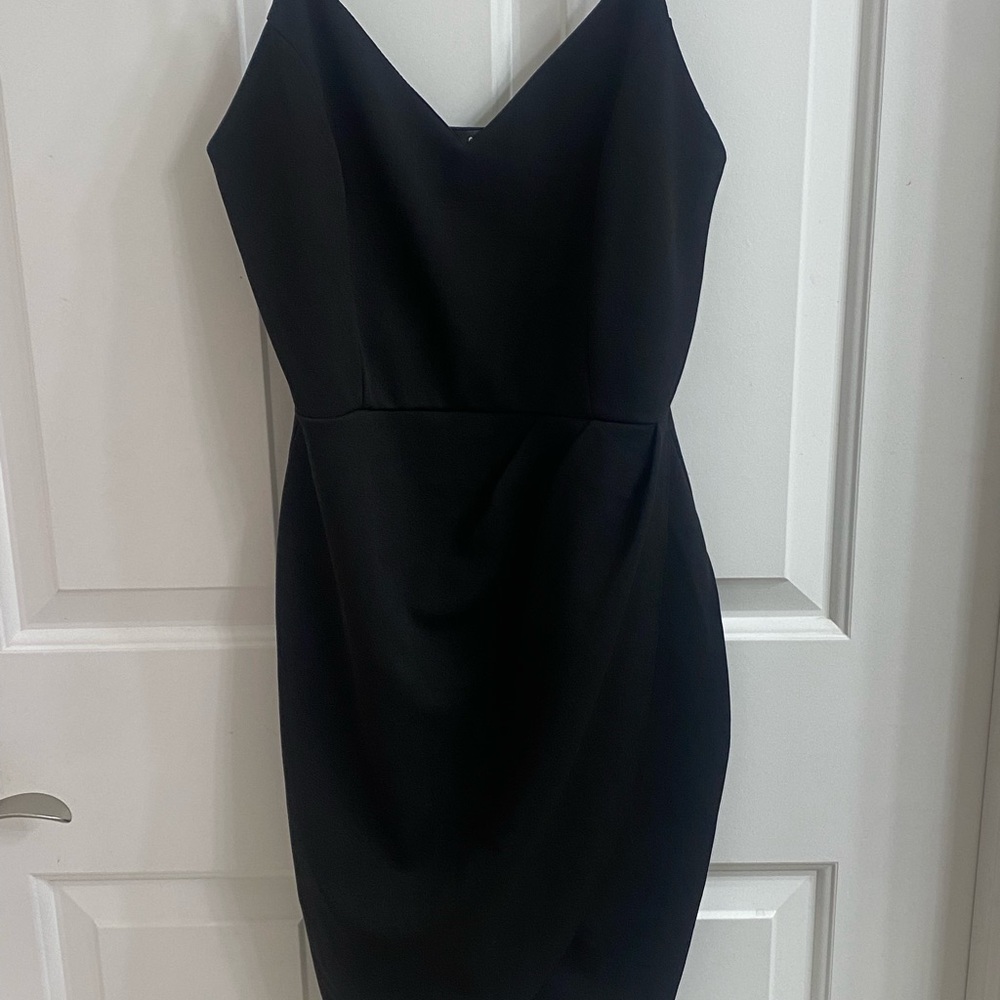 Black Spaghetti strap mini dress cross over. Never worn.